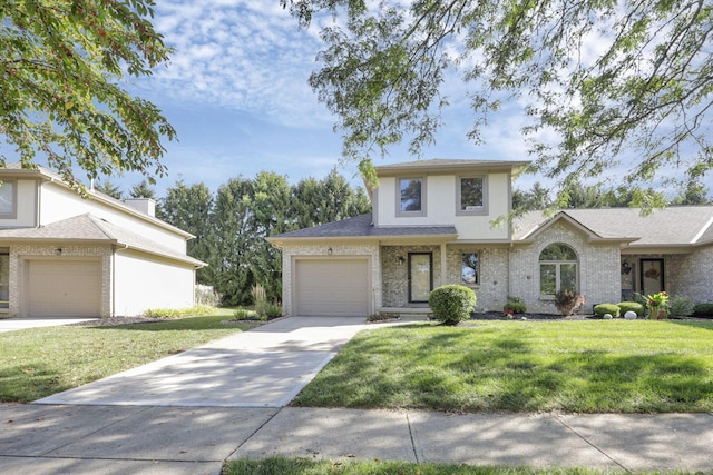 view of front facade with a garage and a front lawn