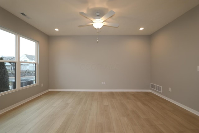 unfurnished room with light hardwood / wood-style floors and ceiling fan