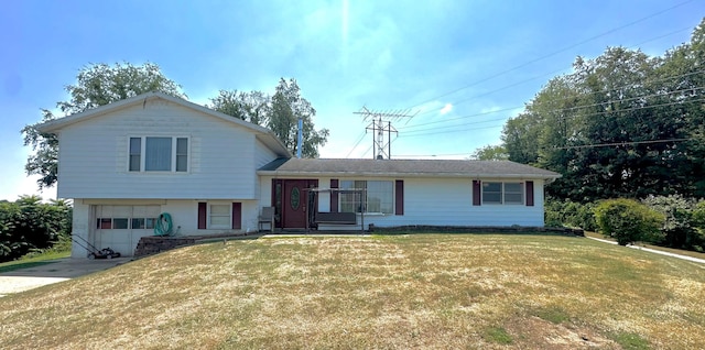 tri-level home with a front yard