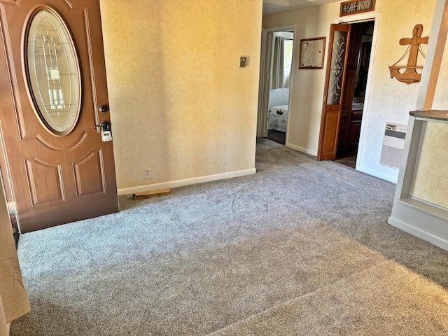 foyer entrance with heating unit and carpet