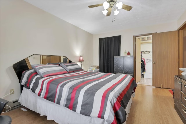 bedroom with light hardwood / wood-style floors and ceiling fan