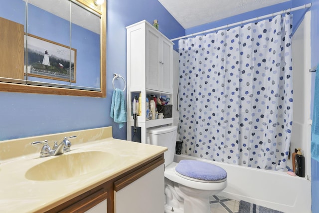 full bathroom featuring shower / tub combo with curtain, vanity, a textured ceiling, and toilet