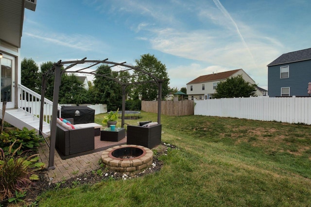 view of yard featuring a pergola and an outdoor living space with a fire pit