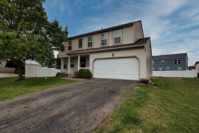 view of front of house featuring a garage and a front yard