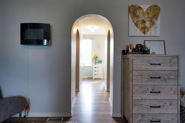 hallway with wood-type flooring