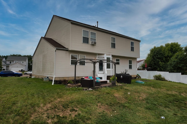 back of house with a lawn