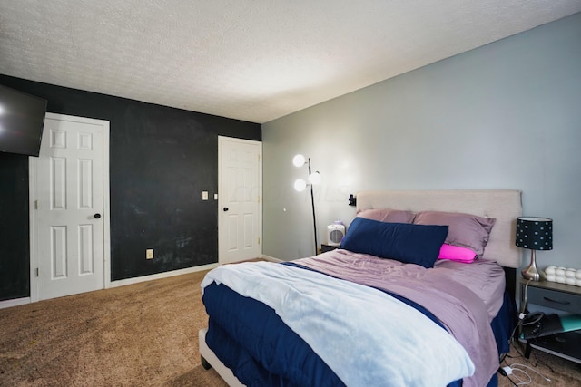 carpeted bedroom featuring a textured ceiling