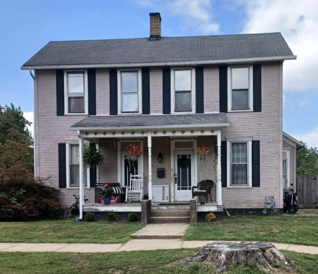 view of front facade with a porch and a front yard