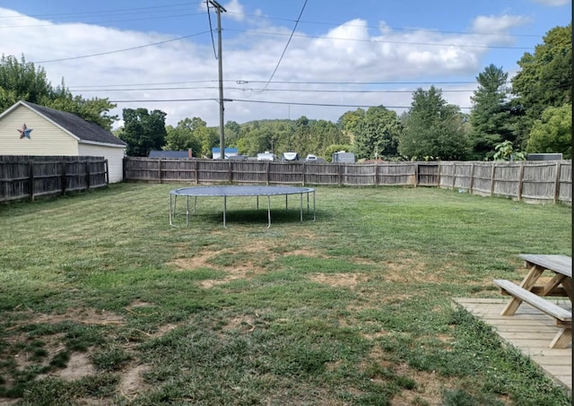 view of yard with a trampoline