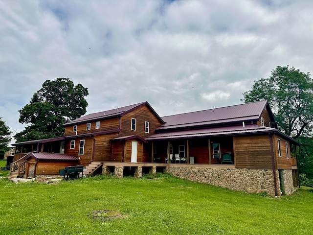 back of house featuring a yard