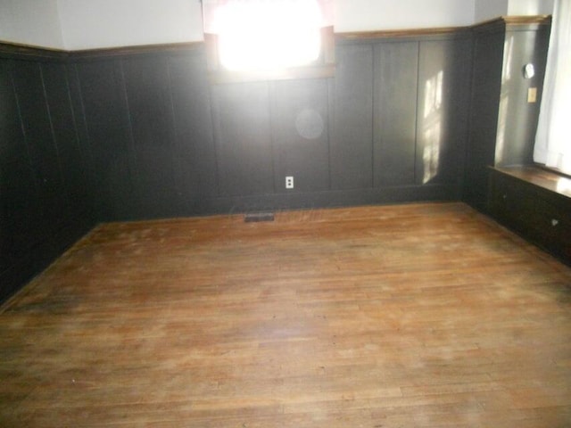 empty room with light hardwood / wood-style floors