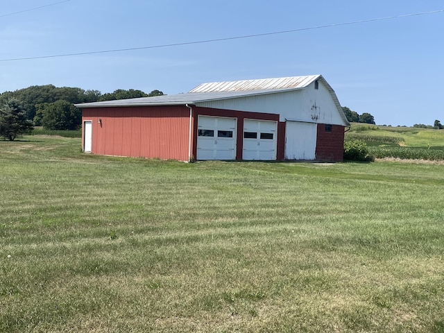 garage with a yard