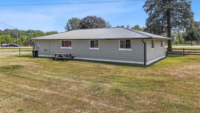 view of property exterior featuring a yard