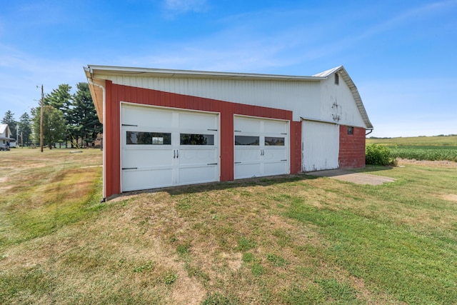 garage featuring a yard