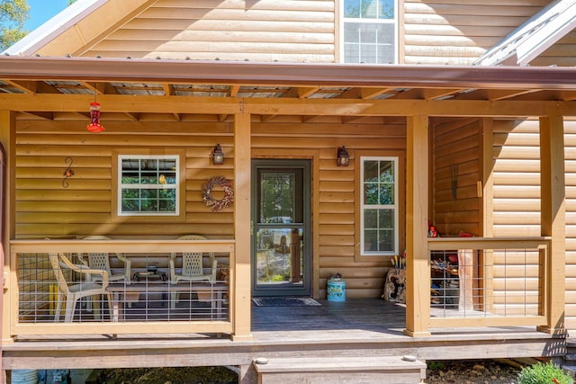 doorway to property with covered porch