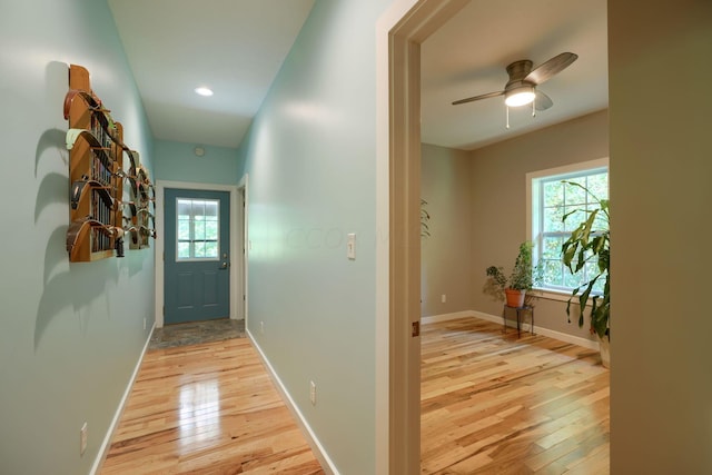 corridor with light hardwood / wood-style flooring