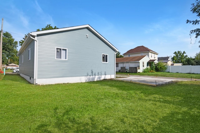 rear view of house with a yard