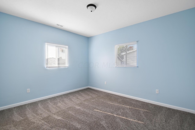 unfurnished room with carpet floors