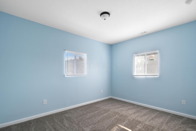 unfurnished room with carpet floors