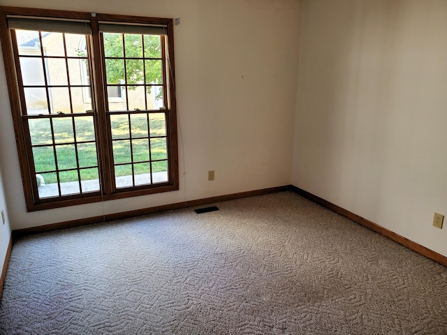 unfurnished room with carpet floors