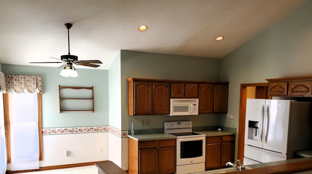 kitchen with ceiling fan, white appliances, and vaulted ceiling