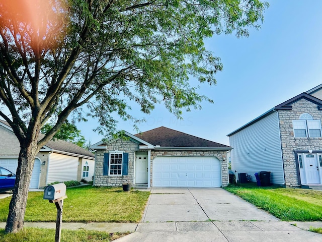 single story home with a garage and a front lawn