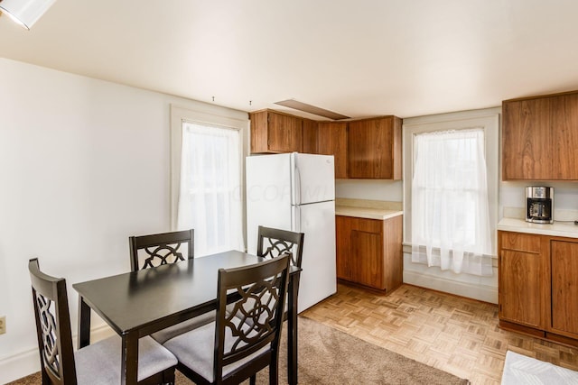 dining area with light parquet flooring