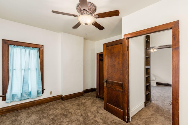 unfurnished bedroom with carpet flooring, ceiling fan, and a closet