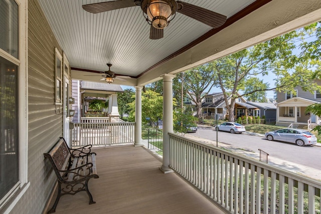 view of patio with ceiling fan and a porch