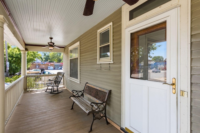 wooden terrace featuring ceiling fan and covered porch