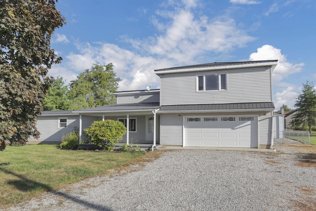 view of front property with a front yard and a garage