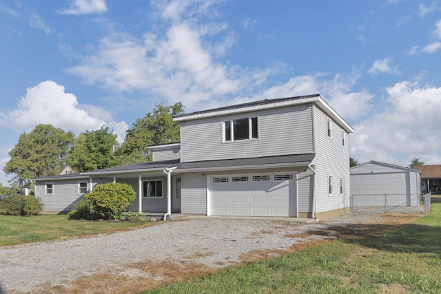 front facade with a front yard and a garage