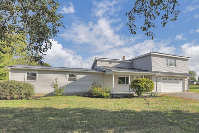 view of front of house featuring a garage and a front yard