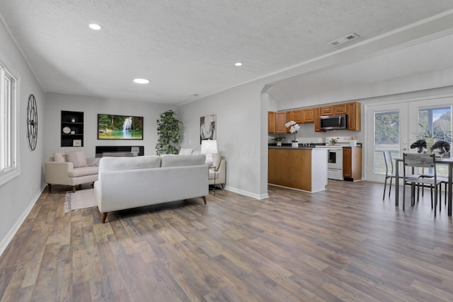 living room featuring a textured ceiling and hardwood / wood-style flooring