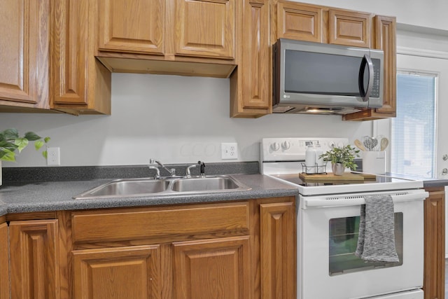 kitchen featuring white range with electric cooktop and sink