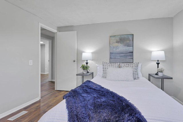 bedroom featuring dark hardwood / wood-style floors