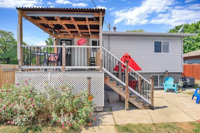 back of property featuring central AC and a patio