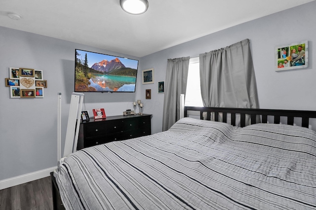 bedroom featuring dark hardwood / wood-style floors