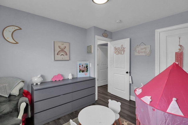 bedroom featuring dark hardwood / wood-style flooring