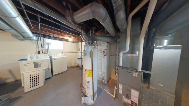 basement featuring independent washer and dryer and gas water heater