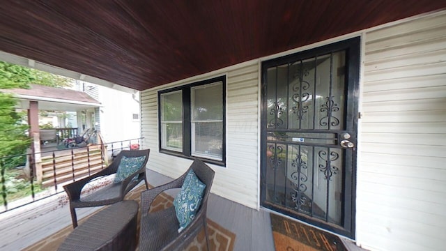 doorway to property with a porch