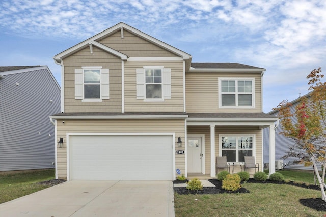 view of front facade with a garage and a front lawn