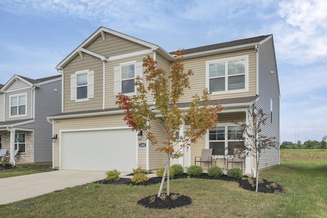 view of front of house with a garage and a front yard