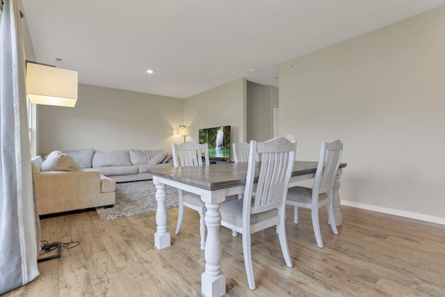 dining space featuring light hardwood / wood-style floors