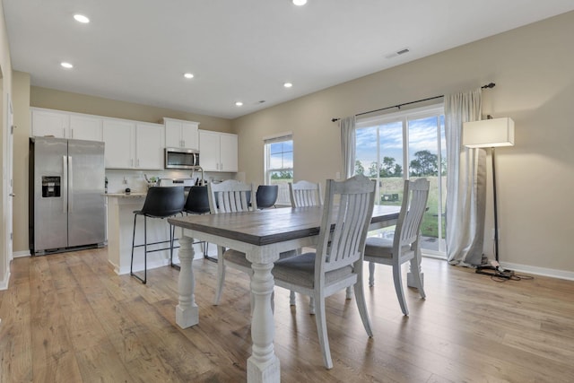 dining room featuring light wood-type flooring