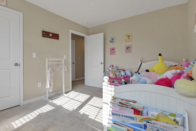 bedroom featuring light carpet