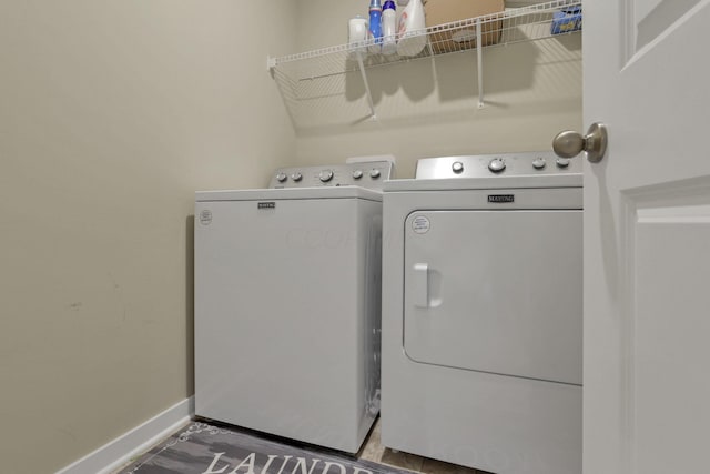 washroom featuring washing machine and clothes dryer