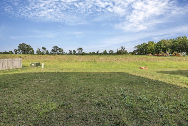 view of yard with a rural view