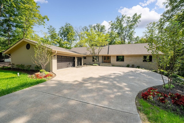 ranch-style home featuring a garage