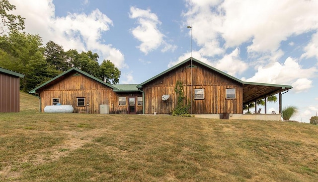 view of front facade with central AC and a front yard